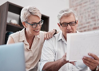 Older couple looking at their finances and taxable income